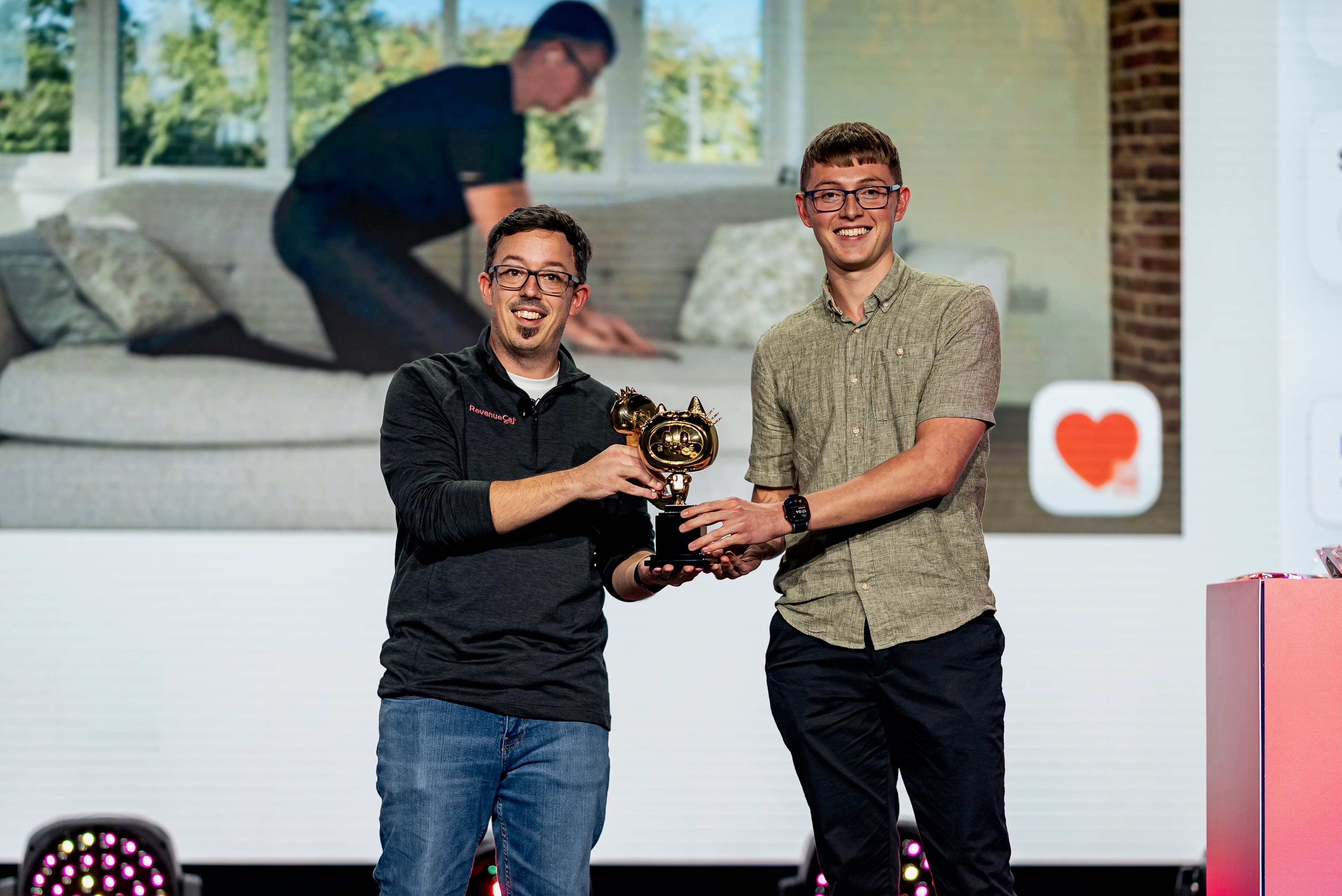 A Shipaton winner accepting a gold Shippy trophy live on stage.